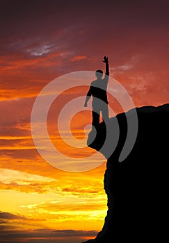 Man on top of mountain.