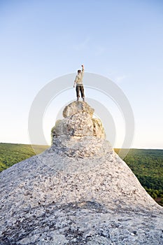 Man on top of mountain.
