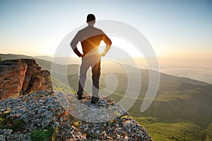 Man on top of mountain