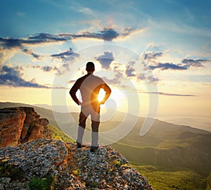 Man on top of mountain