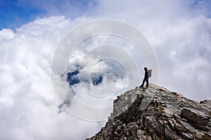 Man on top of mountain photo