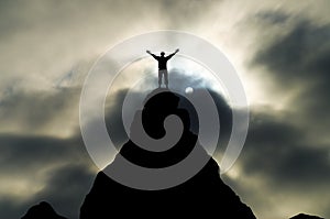 Man on top of mountain photo