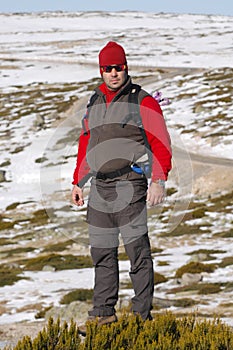 Man in the top of a in mountain hiking