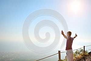 Man on top of a mountain looking for horizon