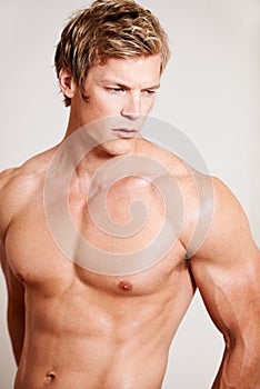 Man, topless and muscle for thinking in studio or white background, confidence or bodybuilder chest. Male person, model