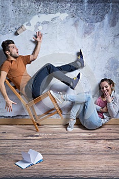 Man on toppling chair photo