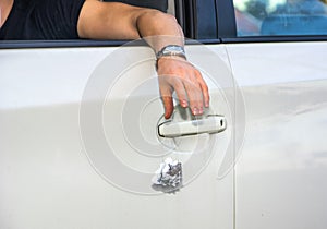 Man Tossing Litter from Open Car Window