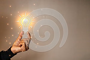 man touching a bright light bulb. Concept of Ideas for presenting new ideas Great inspiration and innovation new beginning.