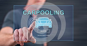 Man touching a carpooling concept on a touch screen