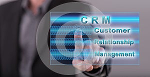 Man touching a crm concept on a touch screen