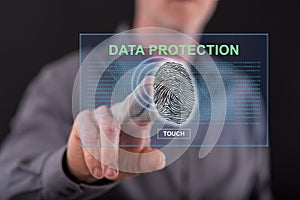 Man touching a data protection concept on a touch screen