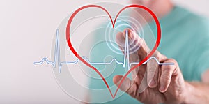 Man touching a heart beats graph