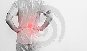 A man touching his back, with red highlight concept of back pain and waist pain concept, on white background