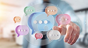 Man touching with his fingers digital speech bubbles talk icons. Minimal conversation or social media messages floating in front
