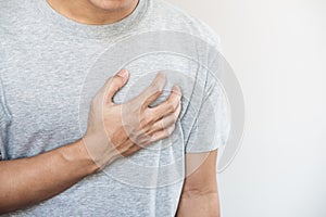 A man touching his heart. Heart attack, heart failure, others heart disease