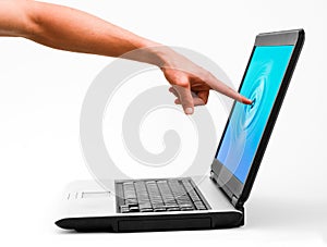 A man touching a notebook computer screen