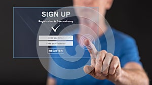 Man touching a signup concept on a touch screen