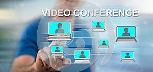 Man touching a video conference concept