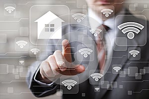 Man with touchscreen house network wifi icon