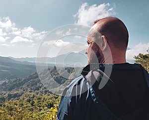 Man tourist admire beautiful mountain view in Bali