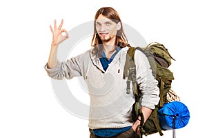 Man tourist backpacker showing ok gesture. Travel.