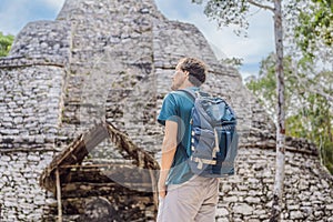 Man tourist at Coba, Mexico. Ancient mayan city in Mexico. Coba is an archaeological area and a famous landmark of