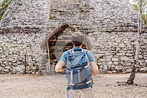 Man tourist at Coba, Mexico. Ancient mayan city in Mexico. Coba is an archaeological area and a famous landmark of