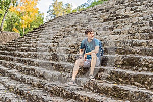Man tourist at Coba, Mexico. Ancient mayan city in Mexico. Coba is an archaeological area and a famous landmark of
