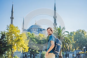 Man tourist enjoying the view Blue Mosque, Sultanahmet Camii, Istanbul, Turkey