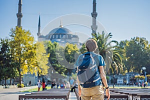 Man tourist enjoying the view Blue Mosque, Sultanahmet Camii, Istanbul, Turkey