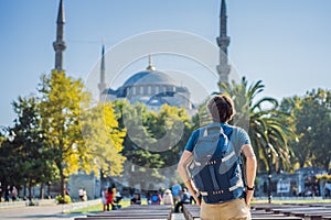 Man tourist enjoying the view Blue Mosque, Sultanahmet Camii, Istanbul, Turkey