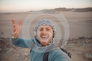 Man tourist make selfie photo on safari in desert Sharm Hurghada, Egypt