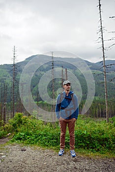 Man tourist in mountain trail