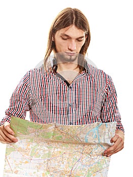 Man tourist reading map on trip. Summer travel.