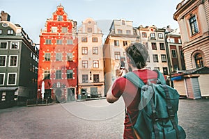 Man tourist sightseeing Stockholm city Gamla Stan landmarks