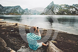 Man tourist taking selfie by smartphone sightseeing