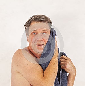 Man toweling hair after shower