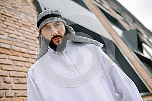 Man in traditional arabian clothing looking serious