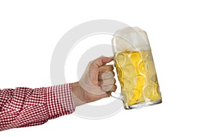 Man in traditional Bavarian shirt holds mug of beer