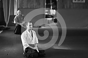 A man in traditional Japanese Aikido training clothes