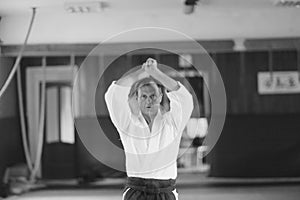 A man in traditional Japanese Aikido training clothes