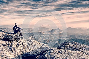 man on the trail looking on high mountain peak