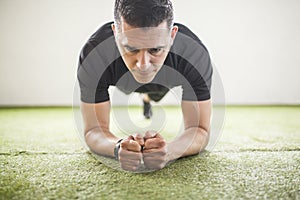 Man training on artificial grass