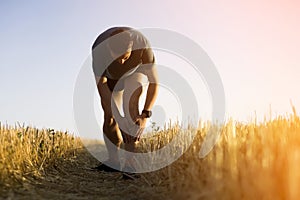 Man is training, running, warming up outdoor.