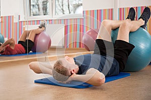 Man training with swiss ball