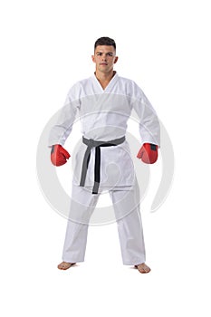Man training taekwondo on white