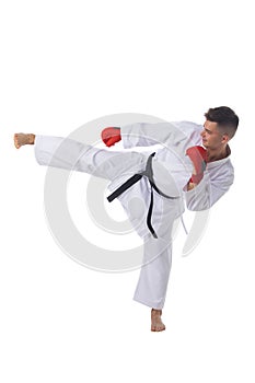 Man training taekwondo on white