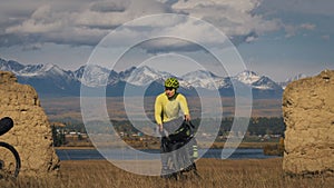 The man travel on mixed terrain cycle touring with bikepacking. The traveler journey with bicycle bags. Sport tourism