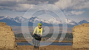 The man travel on mixed terrain cycle touring with bikepacking. The traveler journey with bicycle bags. Sport tourism