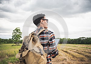 A man travel outdoor nature with storm cloudy background.